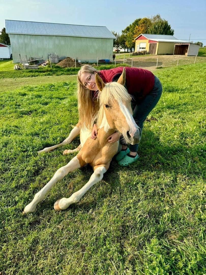 Patrick Casey's daughter beside a gentle horse